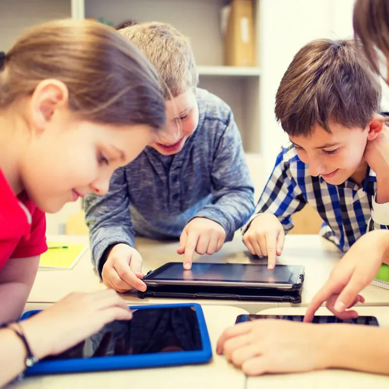 Students learning together on tablets