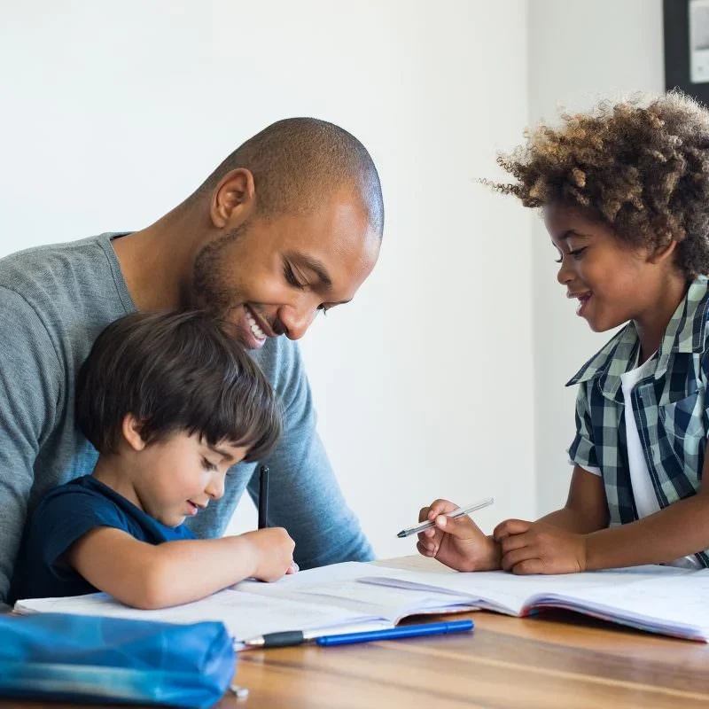 Father teaching children at home